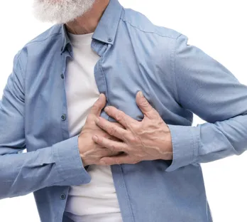 Man clutching heart